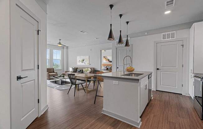 A kitchen with a table and chairs in the middle of the room.
