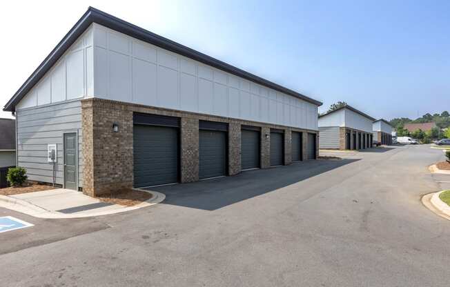 a row of garages with garages on each side of the building at Century University City, North Carolina