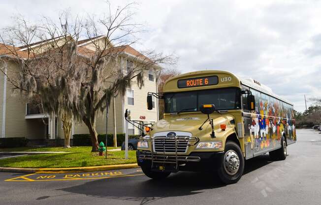 a school bus parked on the street in front of a house