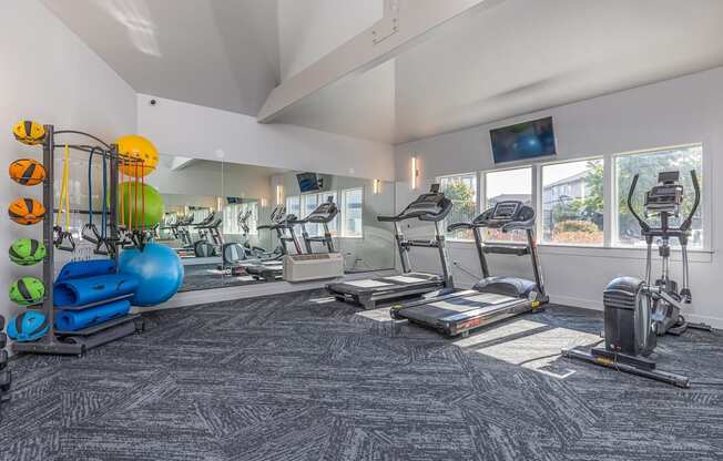 a gym with treadmills and other exercise equipment at the enclave at university heights  at Shoreline Village, Richland, WA