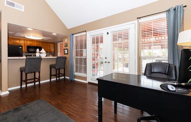 a living room filled with furniture and a large window
