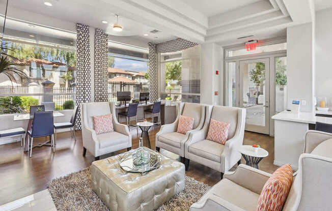 A living room with a white sofa and a glass coffee table.