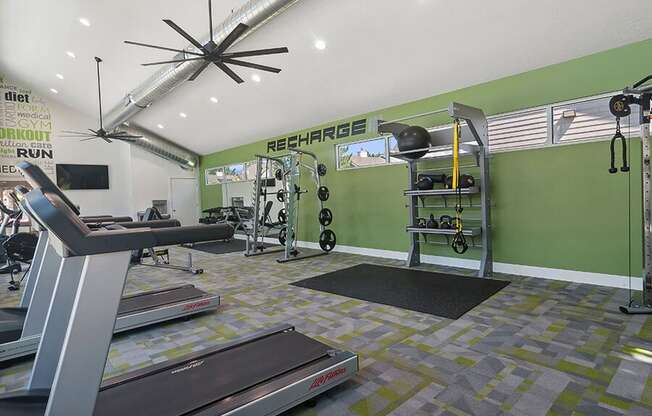 Community Fitness Center with Equipment at Broadmoor Village Apartments located in West Jordan, UT.