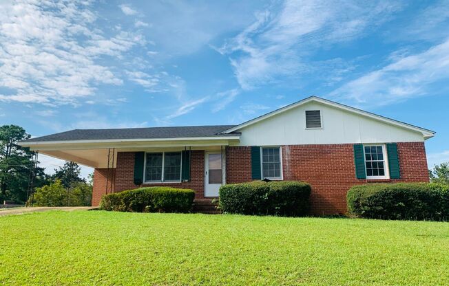 Welcome home! 3 bed, 1.5 bath, newly renovated, brick exterior, carport, hardwood flooring, private lot, must see!
