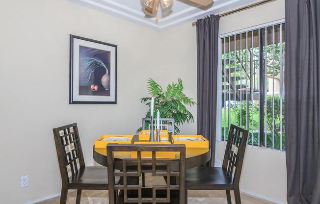 a room filled with furniture and vase on a table