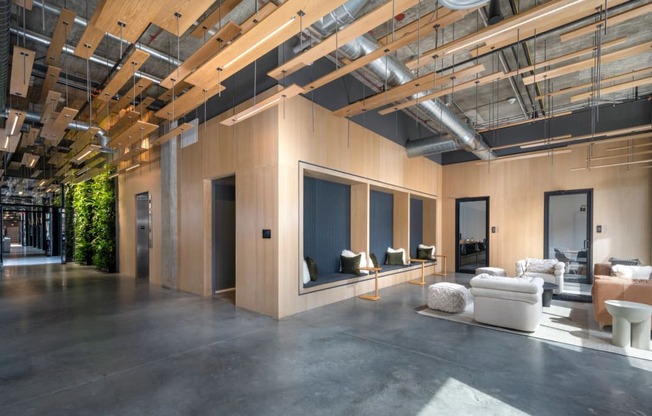 a large living room with large windows and a concrete floor at The Audubon New Haven, New Haven, CT