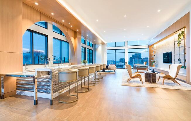 30th-floor sky lounge with panoramic Atlanta views, a hospitality-style kitchen, and expansive gathering spaces designed for entertaining and connection.