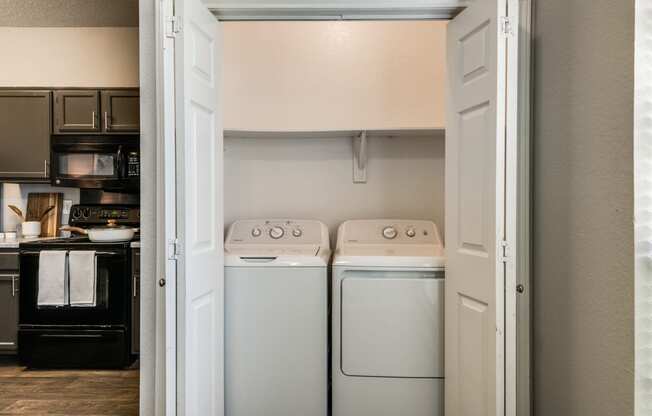 a laundry room with two washes and a dryer in it