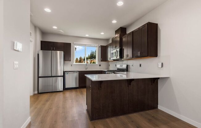 Modern Northshore Townhome with Designer Finishes & 2-Car Garage