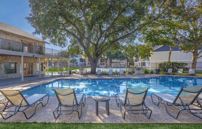 Experience the serene luxury of Distinction Apartment Homes, featuring a stunning poolside oasis surrounded by lush greenery. Enjoy relaxing afternoons and vibrant community amenities that elevate your living experience. Inquire today for more details!