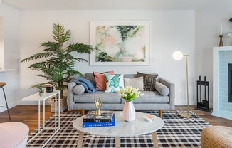 a living room with a gray couch and a coffee table