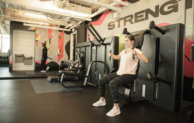 woman working out with resistance equipment at Pixon fitness center at Lake Nona Pixon, Florida, 32827