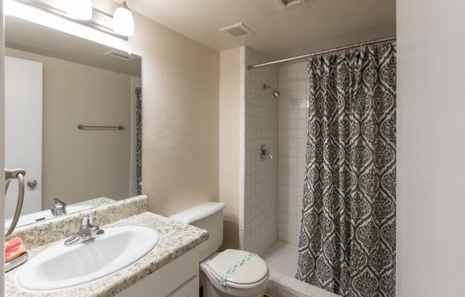 This is a photo of the bathroom in the 965 square foot 2 bedroom, 2 bath  apartment at Harvard Square Apartments, in Dallas, TX.
