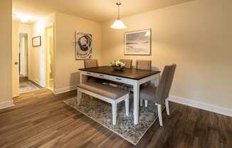 Dining room with six person table with chairs and bench in Randallstown, MD 21133.