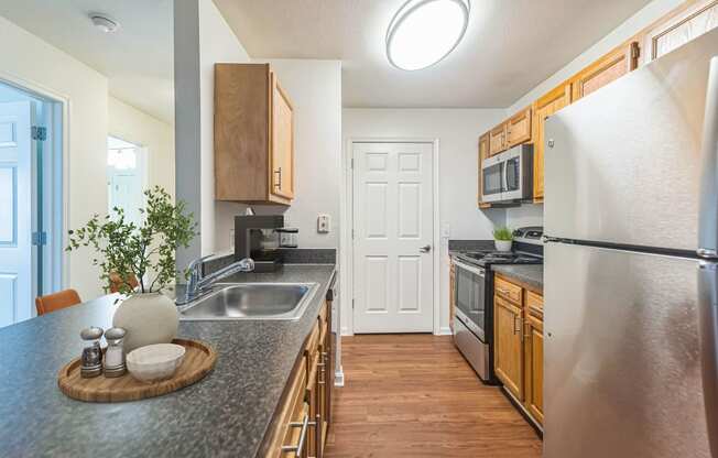 a kitchen with stainless steel appliances and granite counter tops at Sanger Place, Virginia, 22079