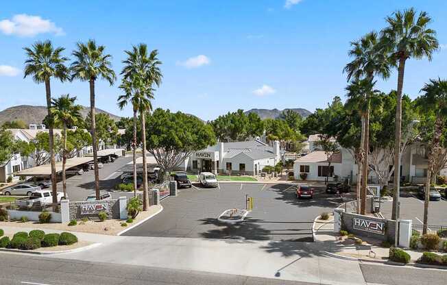 A sunny day at the Haven residential complex with palm trees lining the streets.