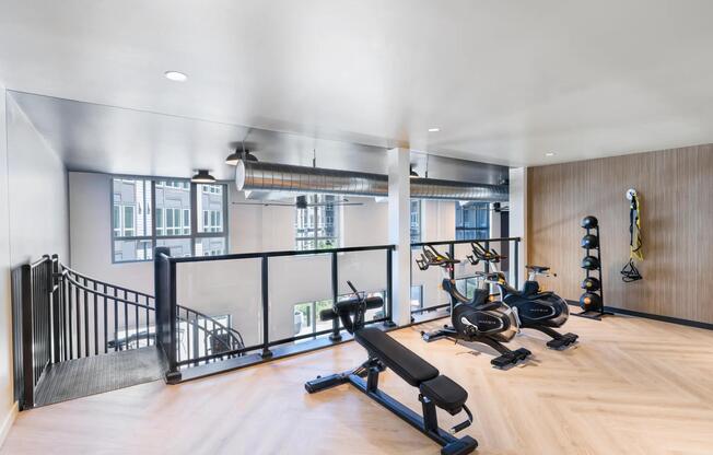 Light-filled and thoughtfully designed, the mezzanine fitness space at Modera Beaverton inspires every workout.