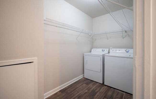 a room with a washer and dryer in it