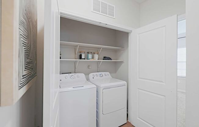 a small laundry room with a washer and dryer in it