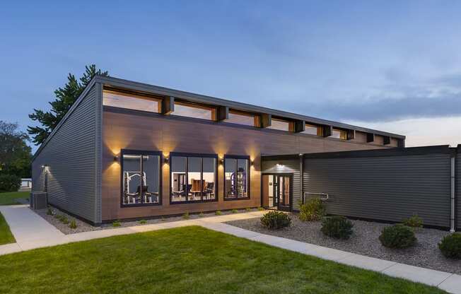 a modern house with a garage and a lawn