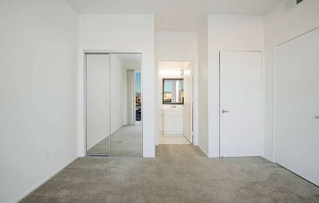 A hallway with a carpeted floor and white walls.at Plaza Lafayette, California  
