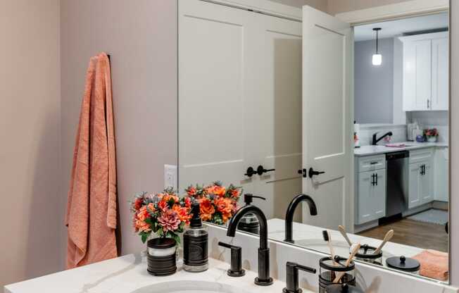 a bathroom with a sink and a mirror