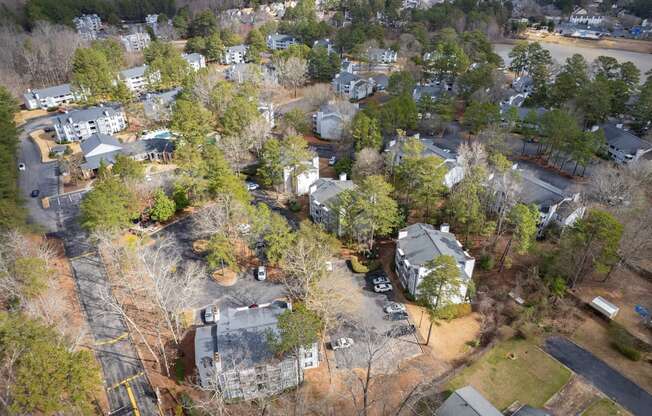 an aerial view of a neighborhood with houses and trees