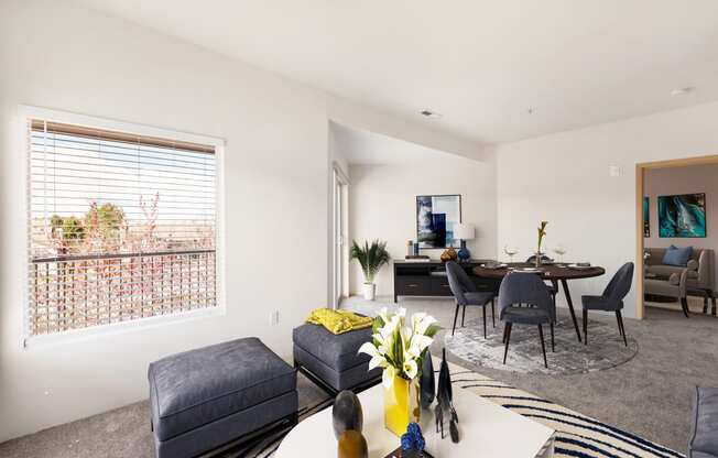 a living room and dining room with a large window. at Shoreline Village, Richland, 99352