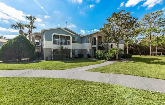 a house with a sidewalk in front of it