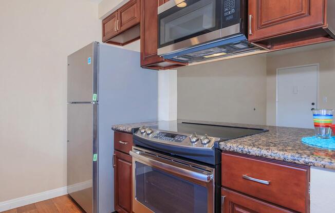 a stove top oven sitting inside of a kitchen