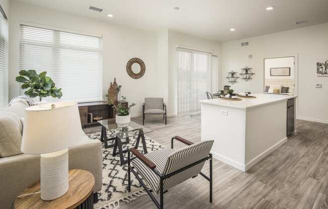 a living room with a kitchen and a dining room