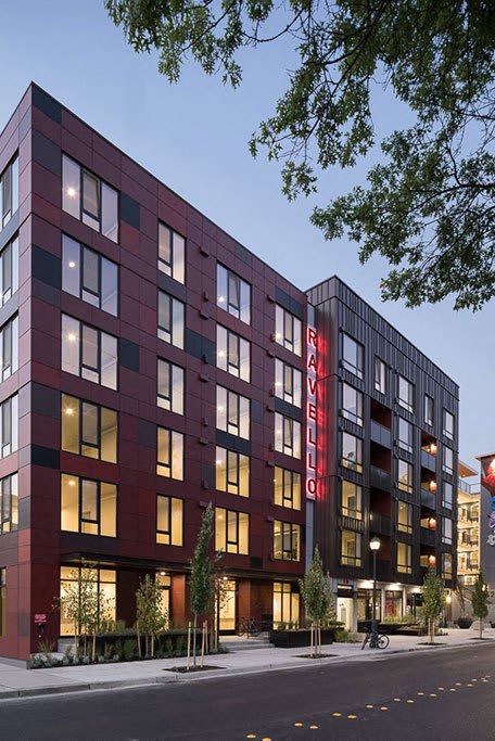 A red and black building with the word  at Ravello Apartments, Redmond, Washington