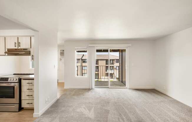 an empty living room with a kitchen to the left  at Brix, Walla Walla, WA, 99362