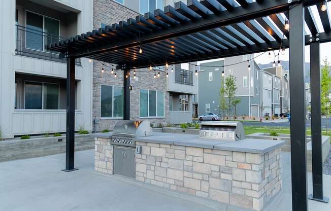 Outdoor Kitchen with a Grill and a Pergola at Parc on 5th II American Fork, UT