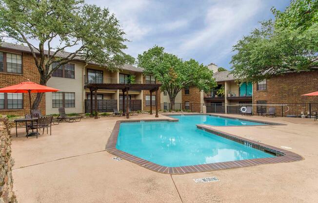 a house with a pool in front of a building