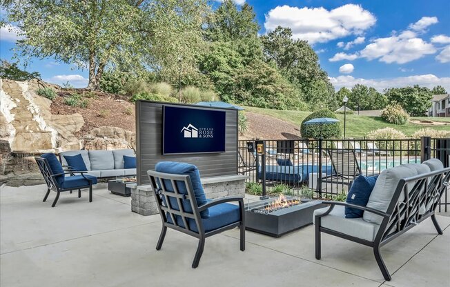 the clubhouse patio with chairs and a fire pit