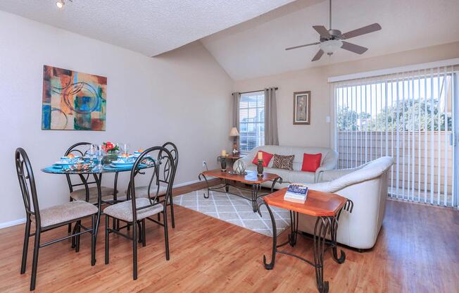 a living room filled with furniture and a wood floor