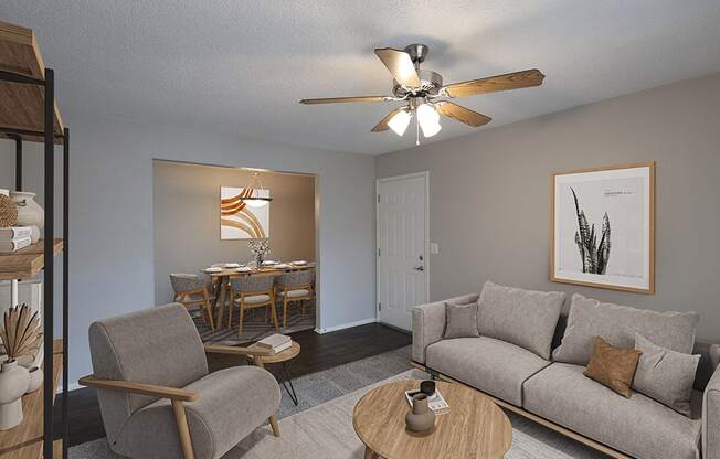 an open living room and dining room with a ceiling fan