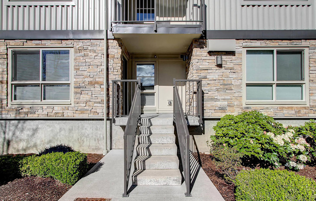 our apartments offer a staircase to the front door of the building at Delano, Redmond, WA 98052