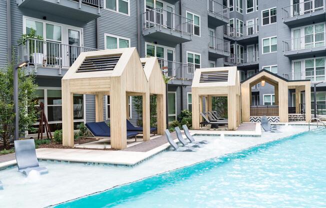 Poolside cabanas at Modera Old Ivy offer shaded lounging, in-water seating, and a polished courtyard setting designed for relaxed Atlanta days.