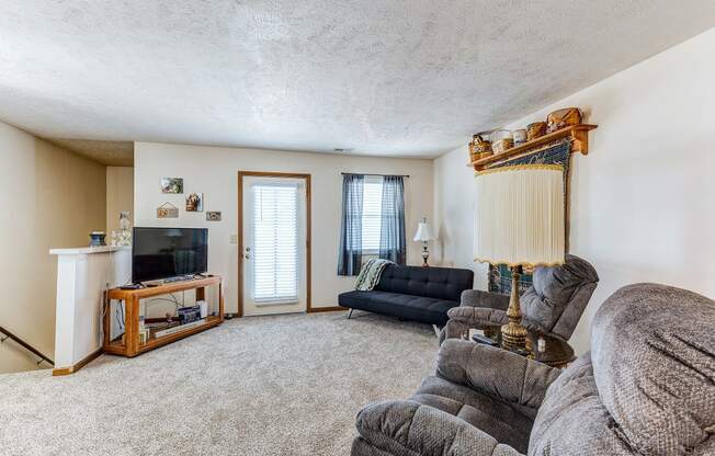 a living room with a couch and a tv