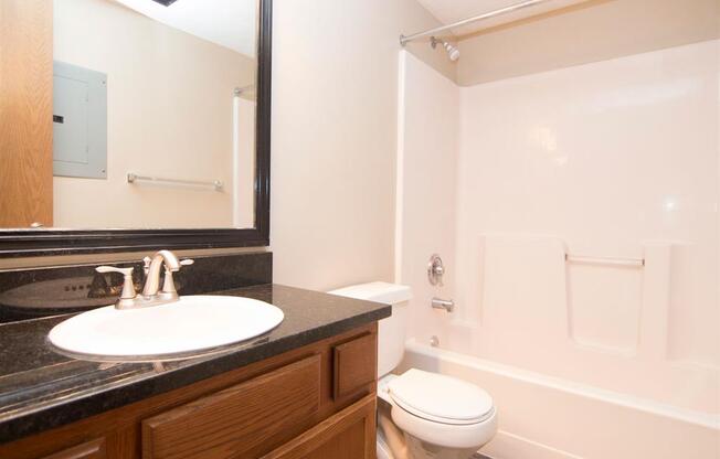 Spacious bathroom with bathtub at Fountain Glen Apartments in Lincoln Nebraska