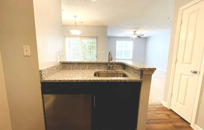 Kitchen peninsula with a sink and a counter top at The Chase, North Carolina, 27215