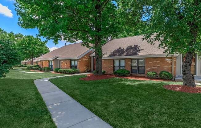 a row of houses with trees in front of them