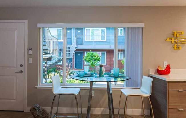 Apartments for Rent in Campbell- Parc at Pruneyard- Glass Dining Table with Spacious Window and Neutral Walls
