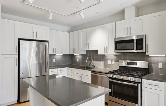 Kitchen with white cabinets at Park77 Apartments, Cambridge, MA