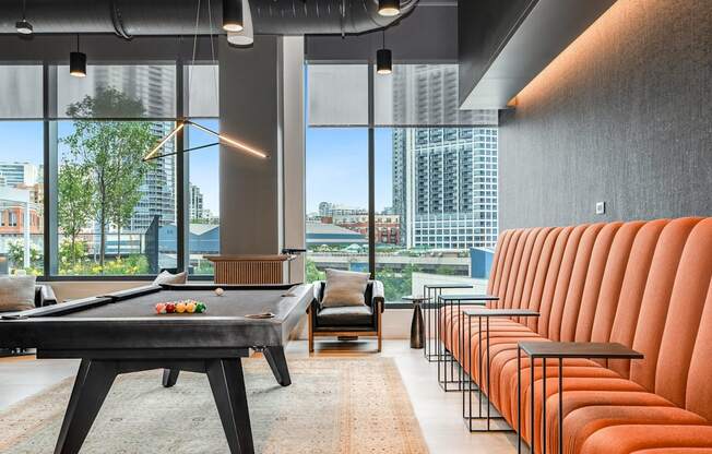 a living room with a pool table and chairs  at Cassidy on Canal, Illinois