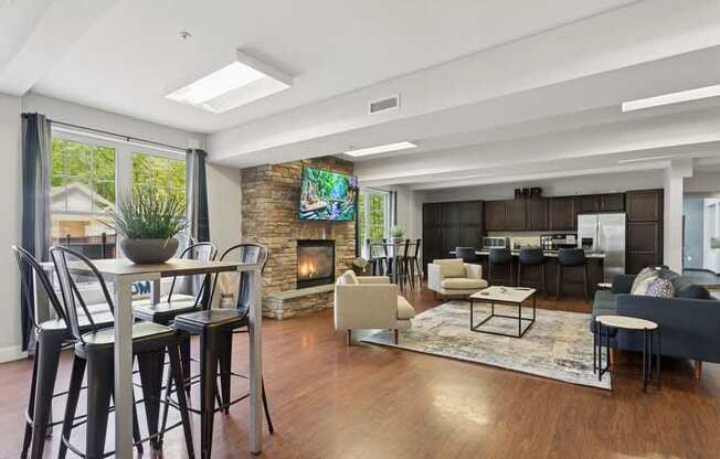 A modern living room with a fireplace and a dining table.