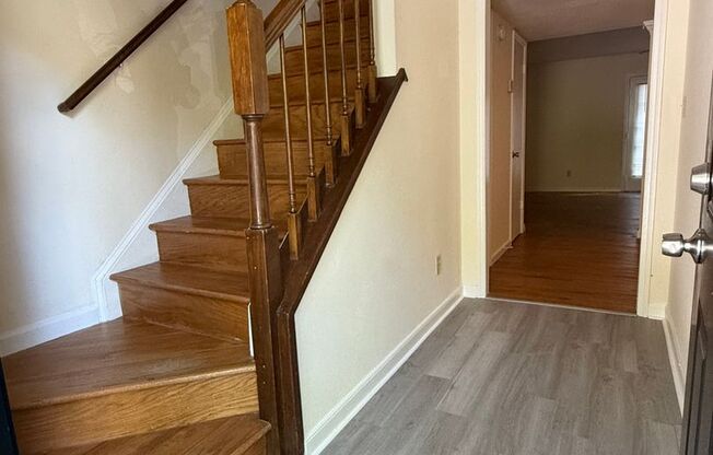 Tastefully renovated townhome with new hardwoods/tile close to 75!