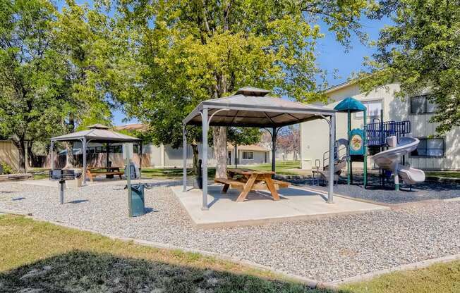 Beautiful covered picnic area by the apartment community playground. 